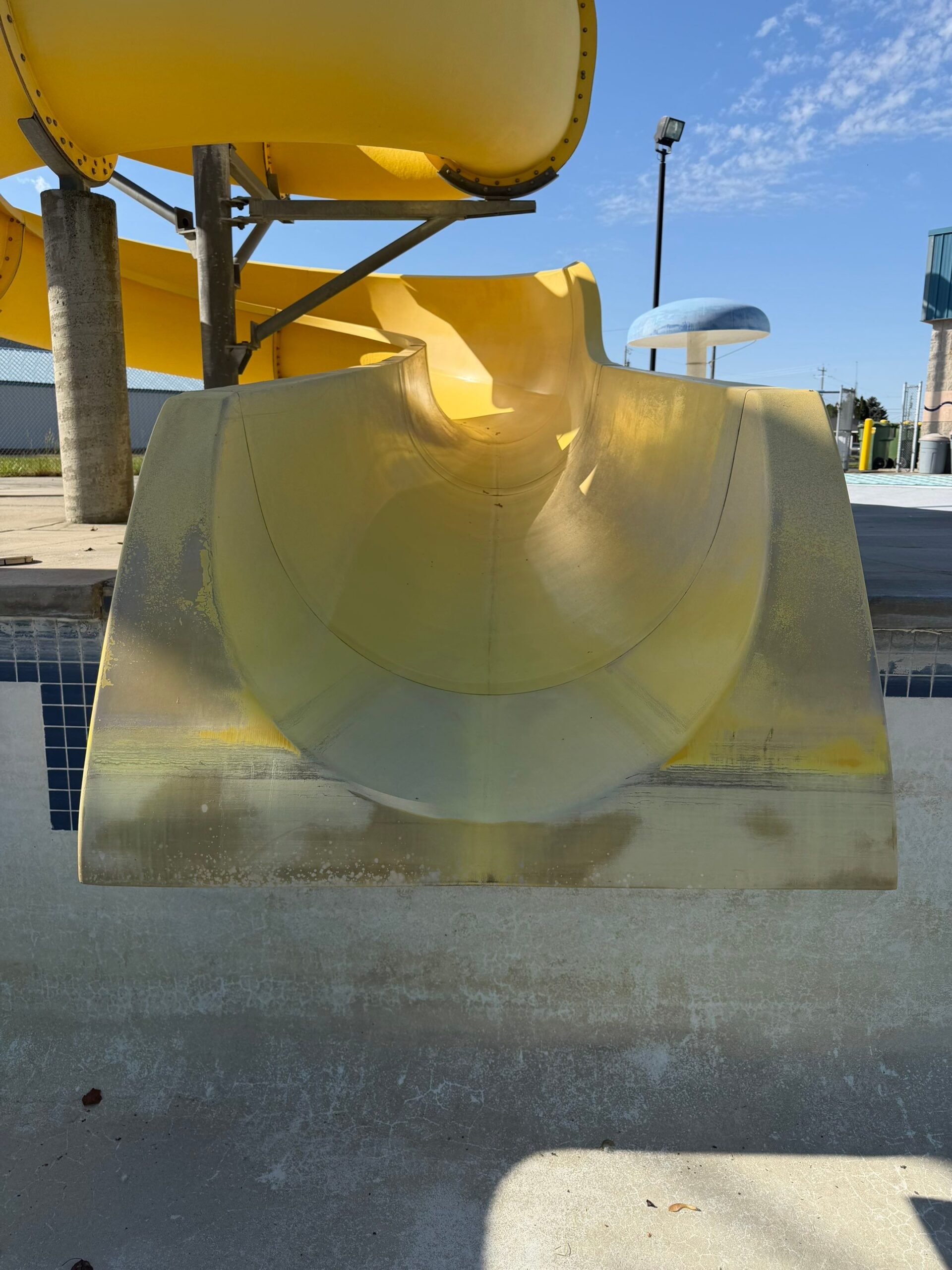 Before restoration exit section of faded yellow waterslide at Ritzville Waterpark