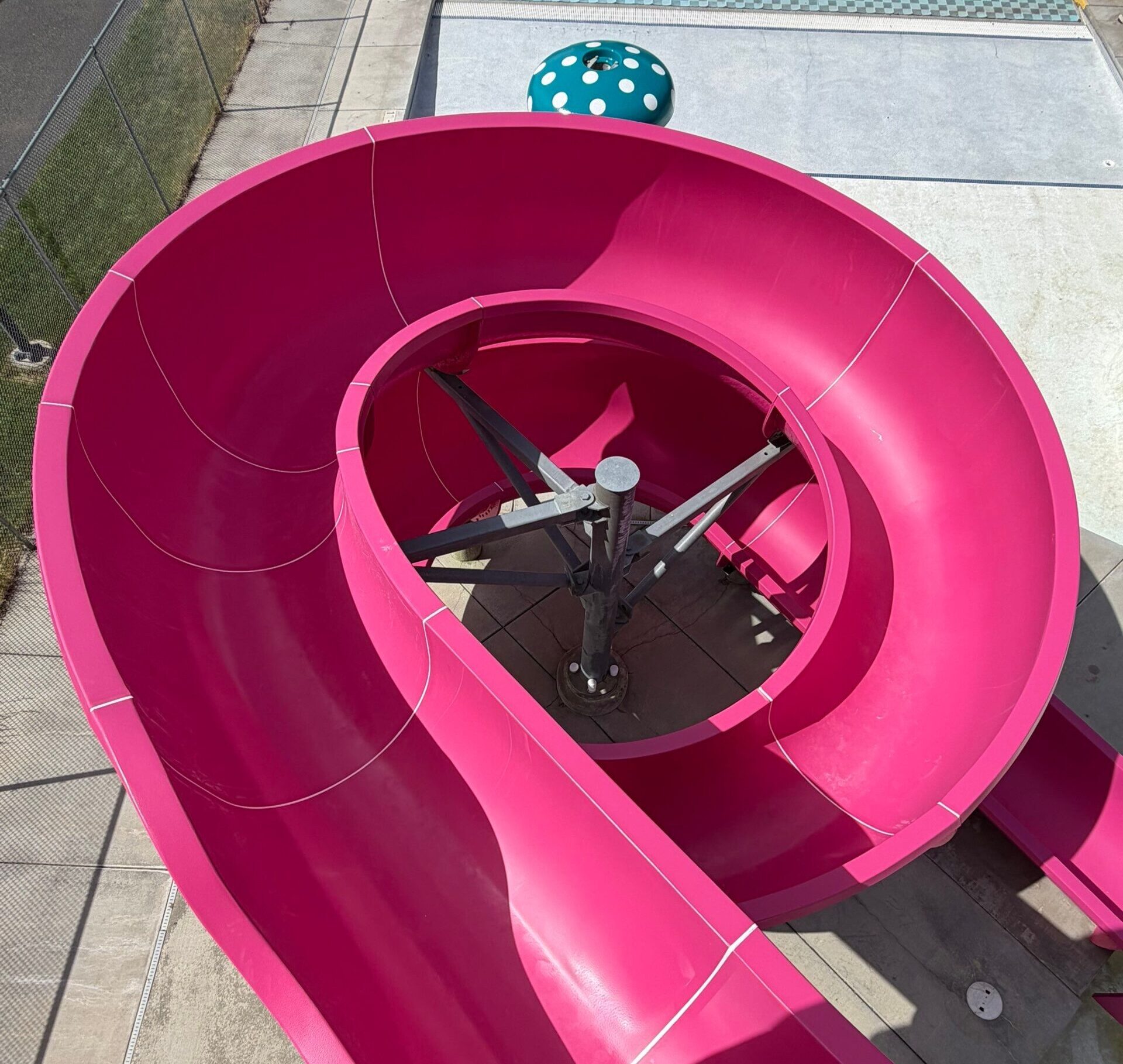 After restoration overhead view of vibrant pink open flume body slide at Ritzville Waterpark