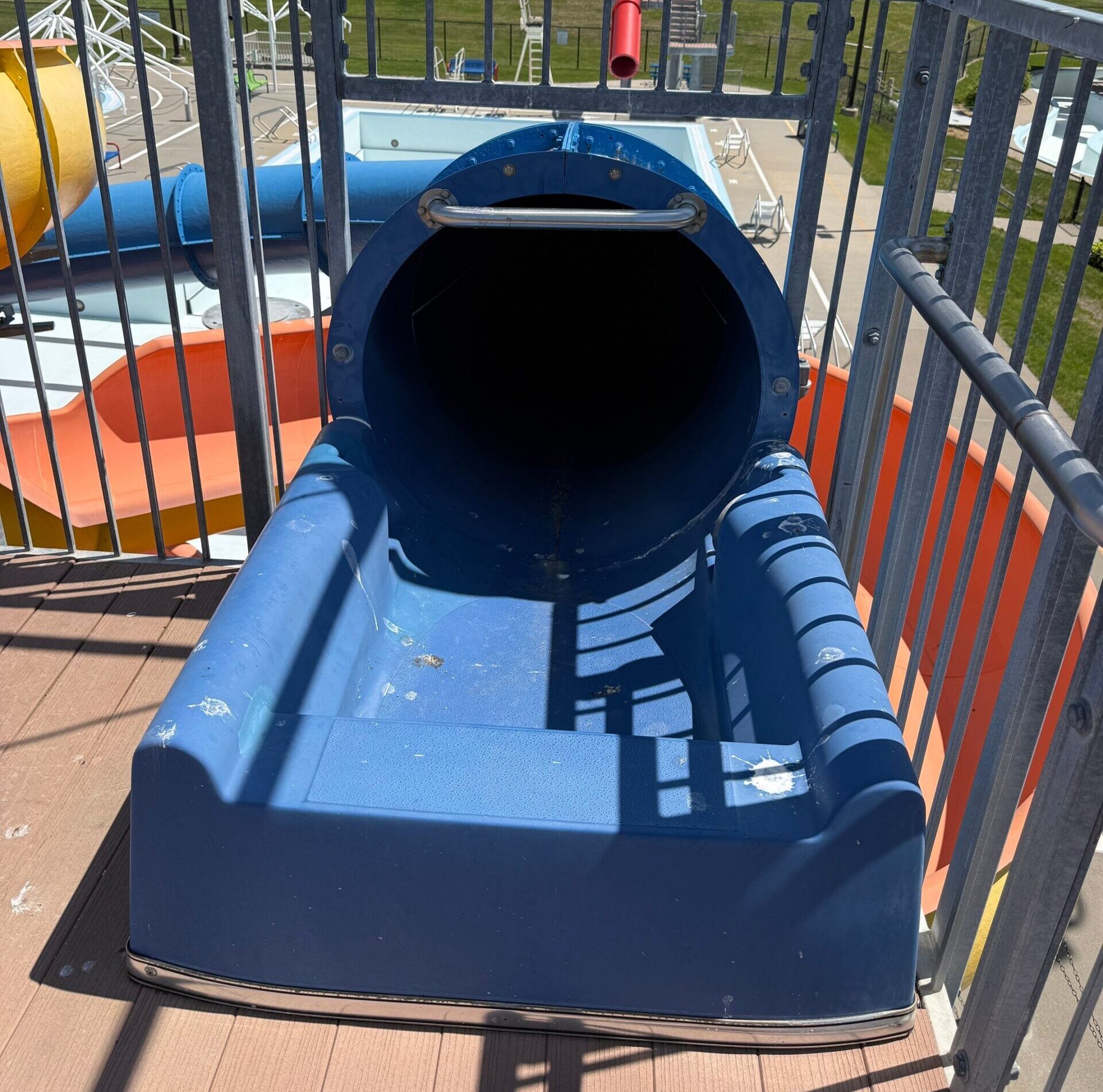 Blue enclosed body slide start tub before restoration at Pella Aquatic Center